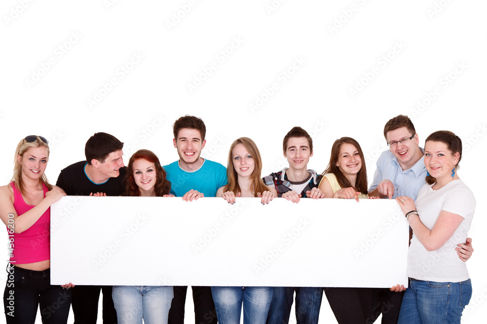 group of friends standing together with white billboard group of friends standing together with white billboard