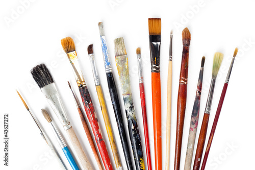 Variety of brushes is lying on white background, isolated