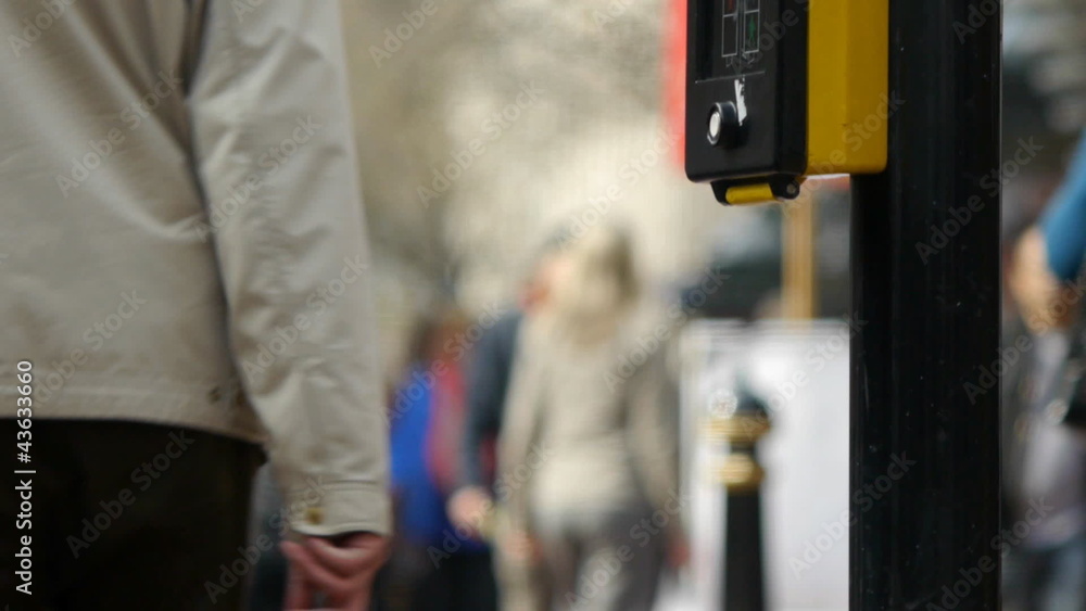 Busy urban street with people  walking past the camera.