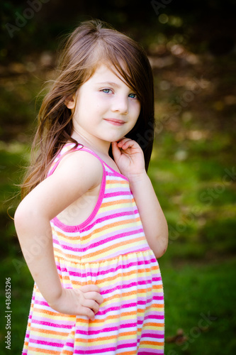 Outdoor portrait of cute young girl in park
