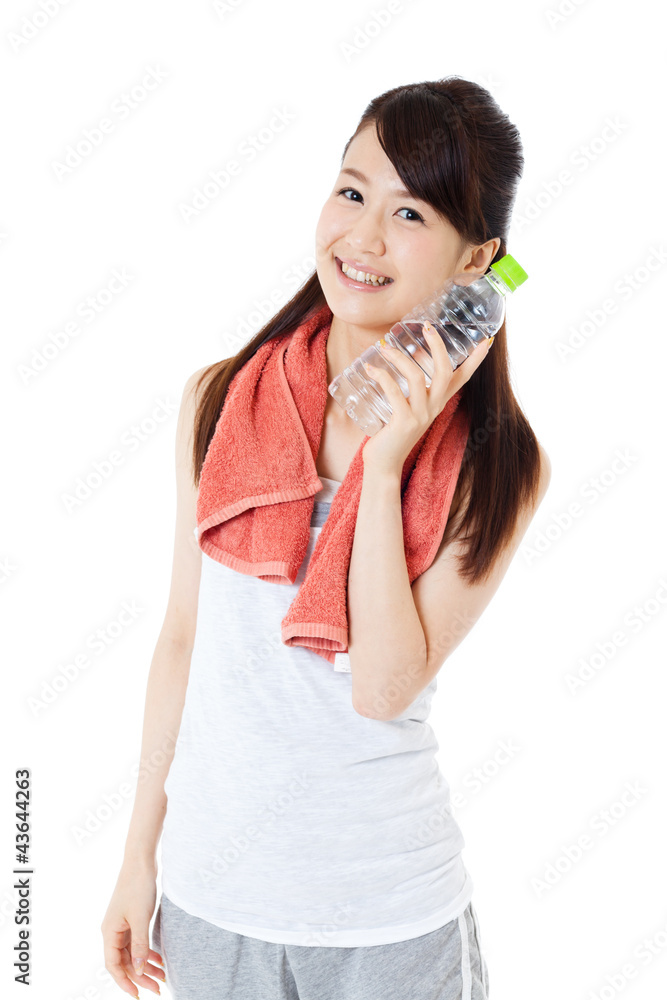 Beautiful young woman drinking water at workout Beautiful young woman drinking water at workout