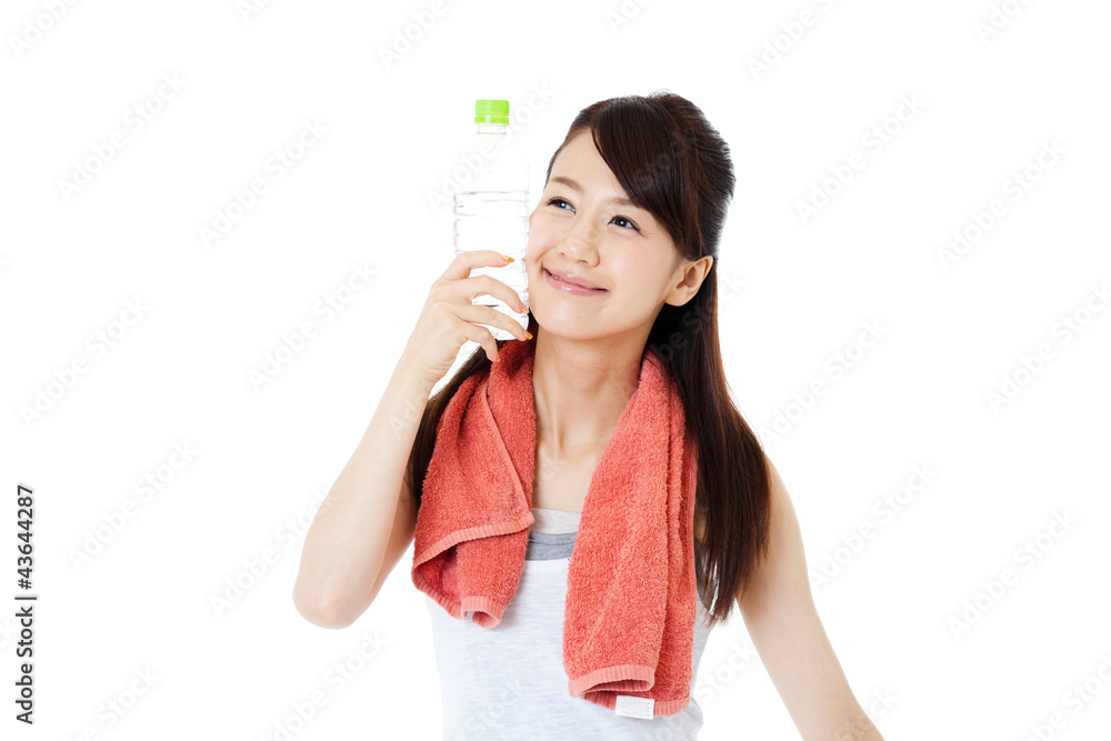 Beautiful young woman drinking water at workout Beautiful young woman drinking water at workout