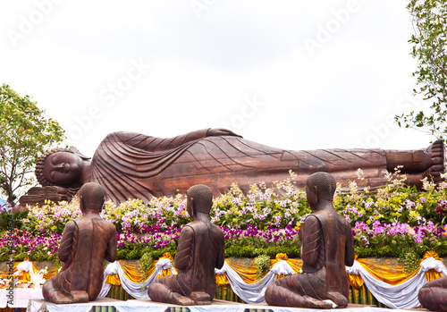 reclining buddha and disciple in thailand