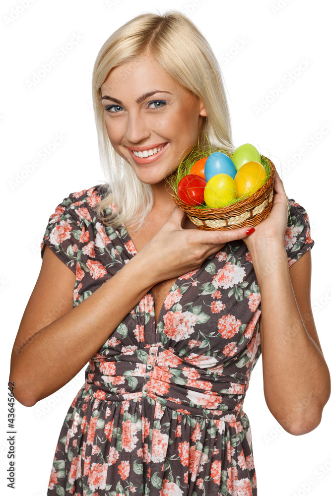 Happy female holding basket with Easter eggs Happy female holding basket with Easter eggs