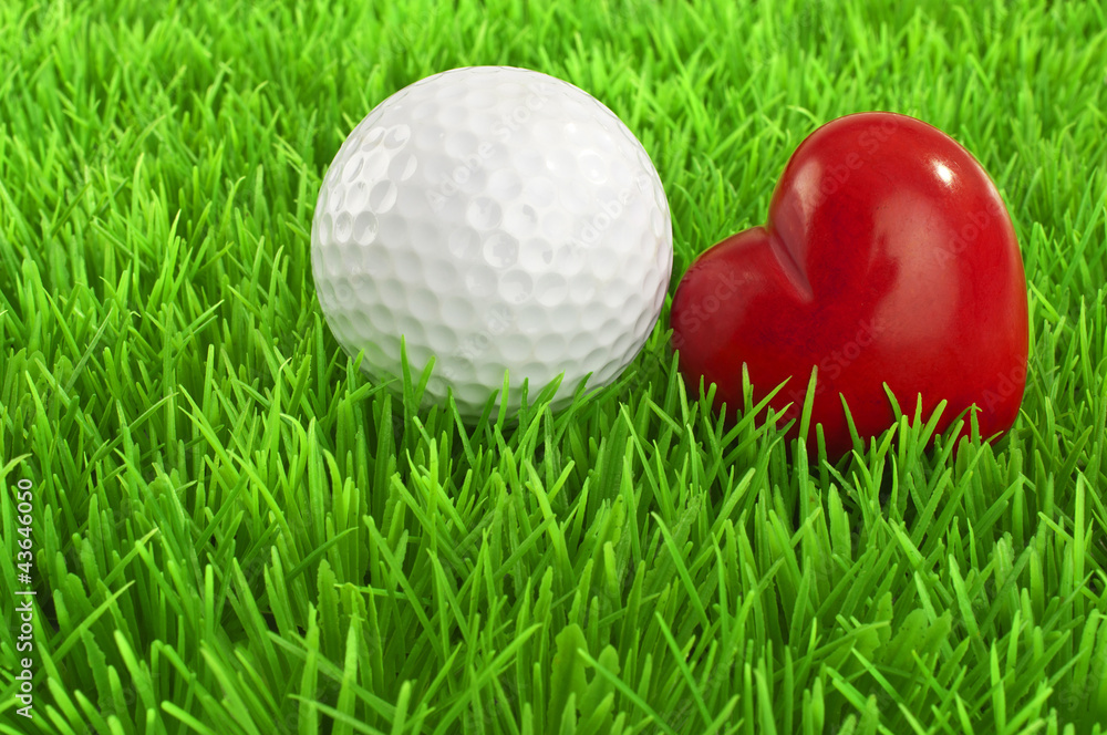 Naklejka premium Love Golf - white golf-ball and red heart on the fairway
