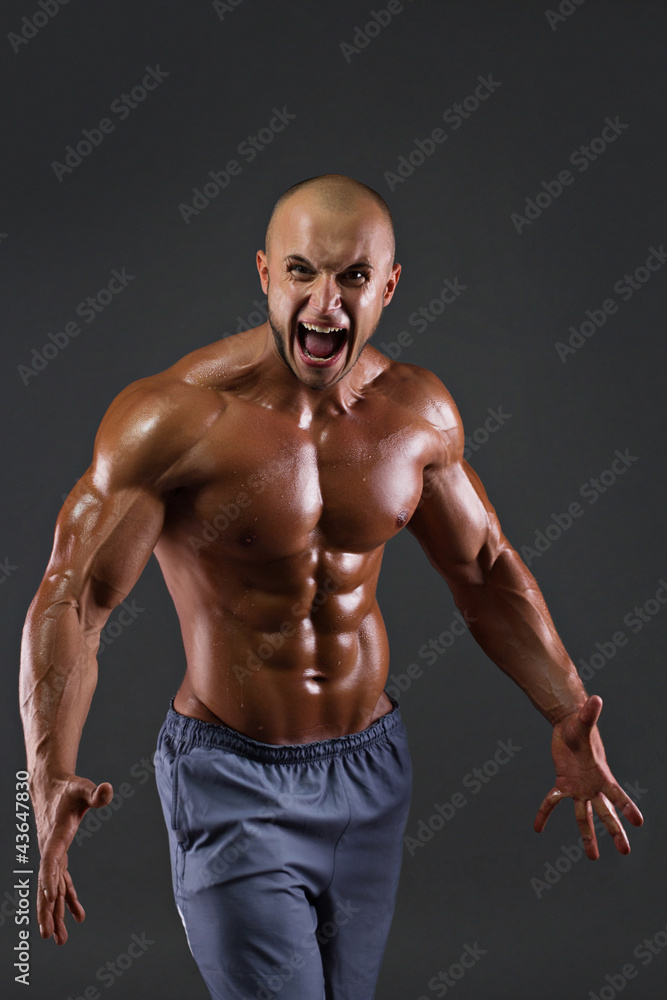 Portrait of muscular screaming men