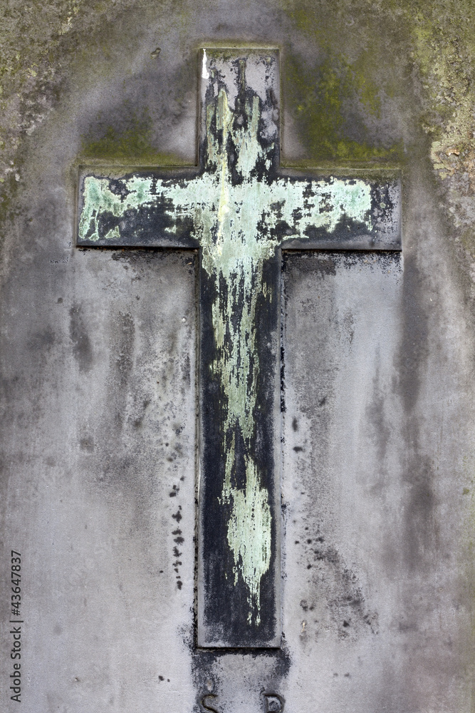 Old cement grunge cross on grave