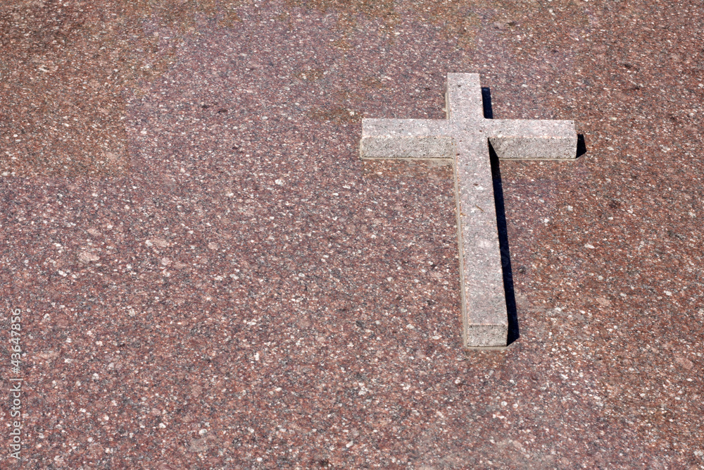 Cross on the marble wall background