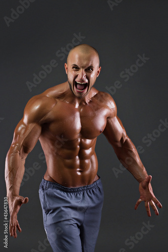 Portrait of muscular screaming men