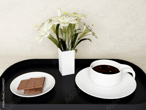 a chocolate, the flowers and coffee
