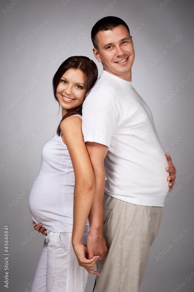 Portrait of young pair pending the kid Portrait of young pair pending the kid