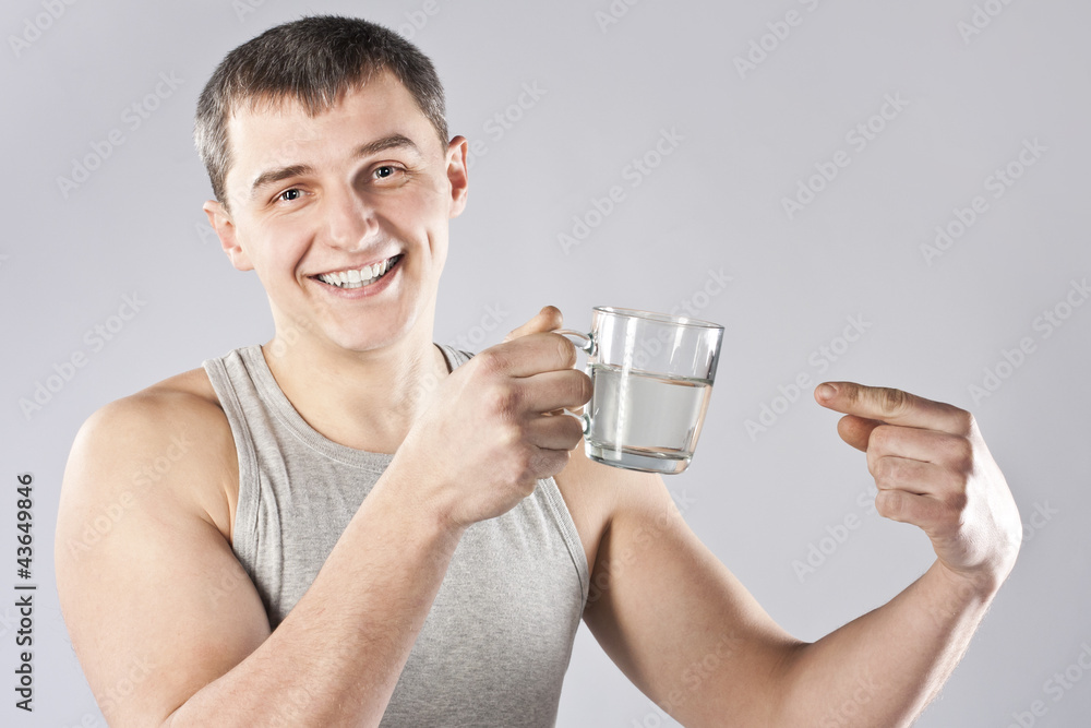 Young handsome man drinking mineral water Young handsome man drinking mineral water
