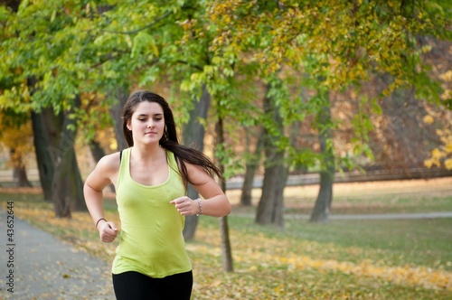 Young person jogging outdoor in nature