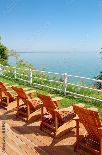 Sea view area with wooden chairs at the modern luxury hotel, Pie