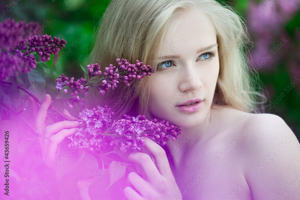 Woman with a lilac flowers. Woman with a lilac flowers.