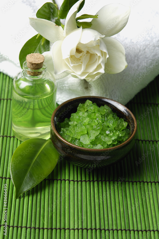 bath salt and gardenia flower on towel with essential oi bath salt and gardenia flower on towel with essential oi