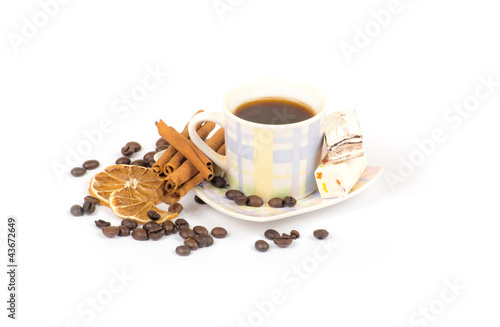 Cup of coffee with ingredients on a white background