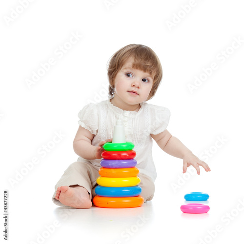 adorable baby playing with ...