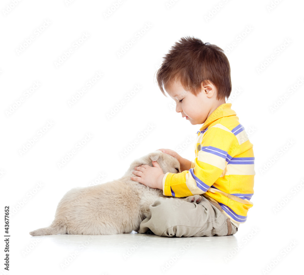 smiling child hugging a puppy smiling child hugging a puppy