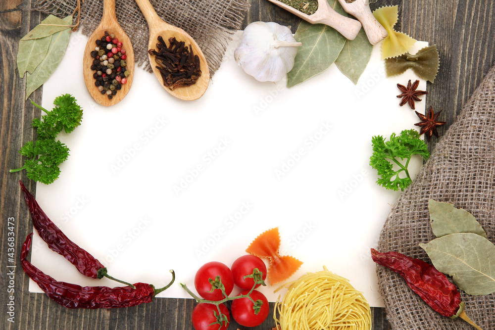 paper for recipes vegetables, and spices on wooden table paper for recipes vegetables, and spices on wooden table