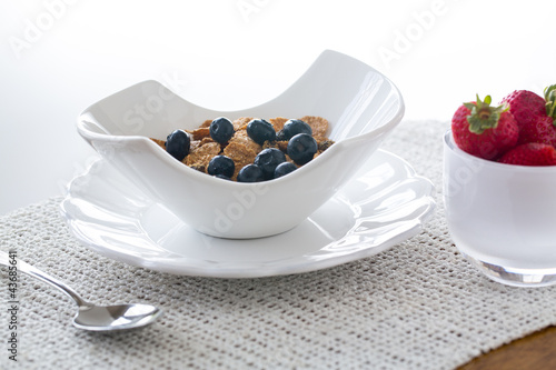 Breakfast of bran flakes blueberries photo