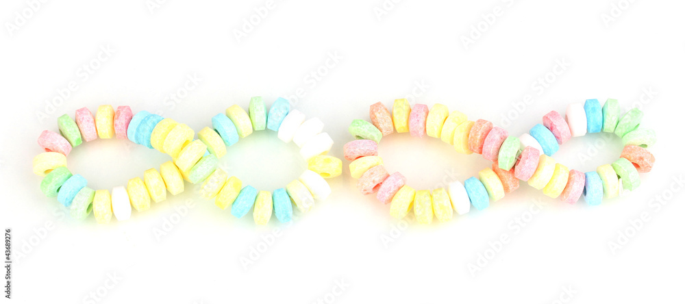 Color candies on rope isolated on white Color candies on rope isolated on white
