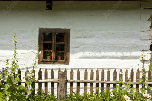 Vintage looking window of an old wooden house photo