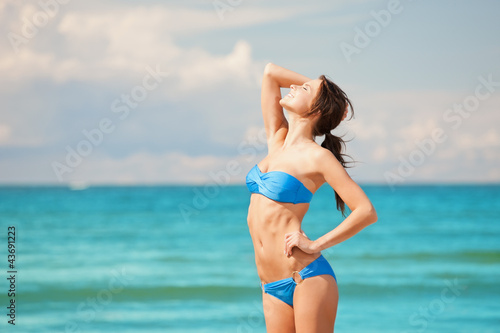 happy smiling woman on the beach © Syda Productions