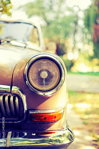 Close-up photo of retro car headlights #43694216