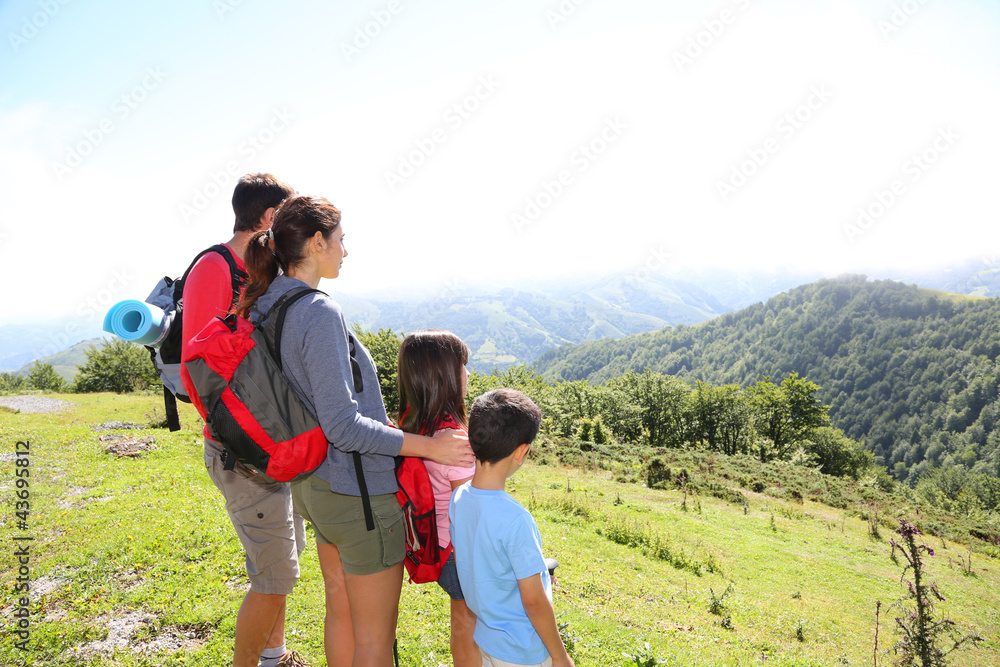 Family on a trek day in the mountain looking at the view