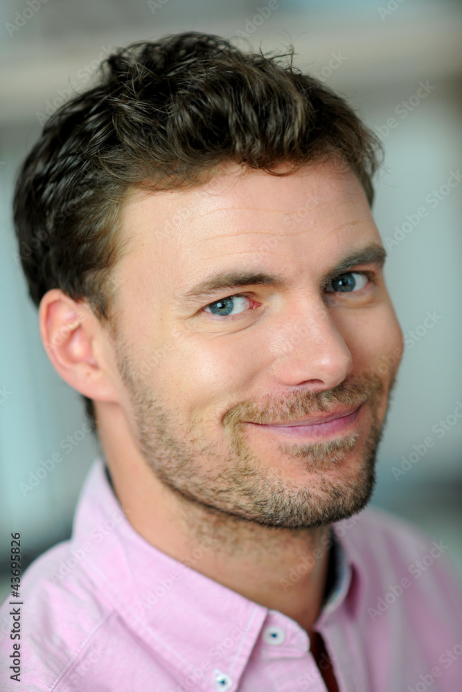 Obraz premium Portrait of handsome young smiling man