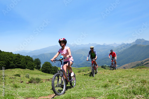 Family riding bikes in the mountains