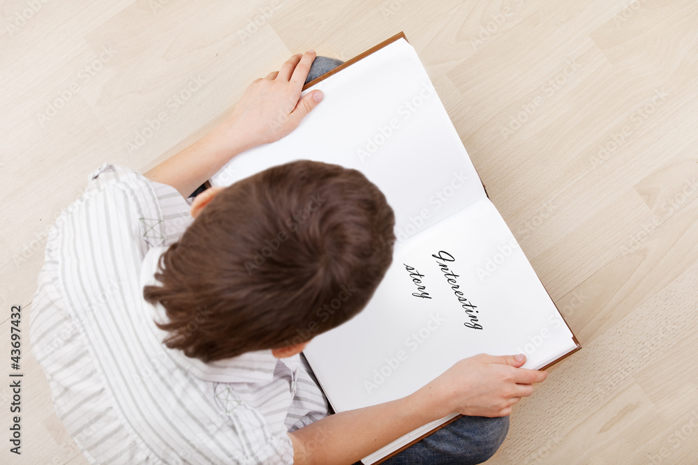 Boy reading book Boy reading book