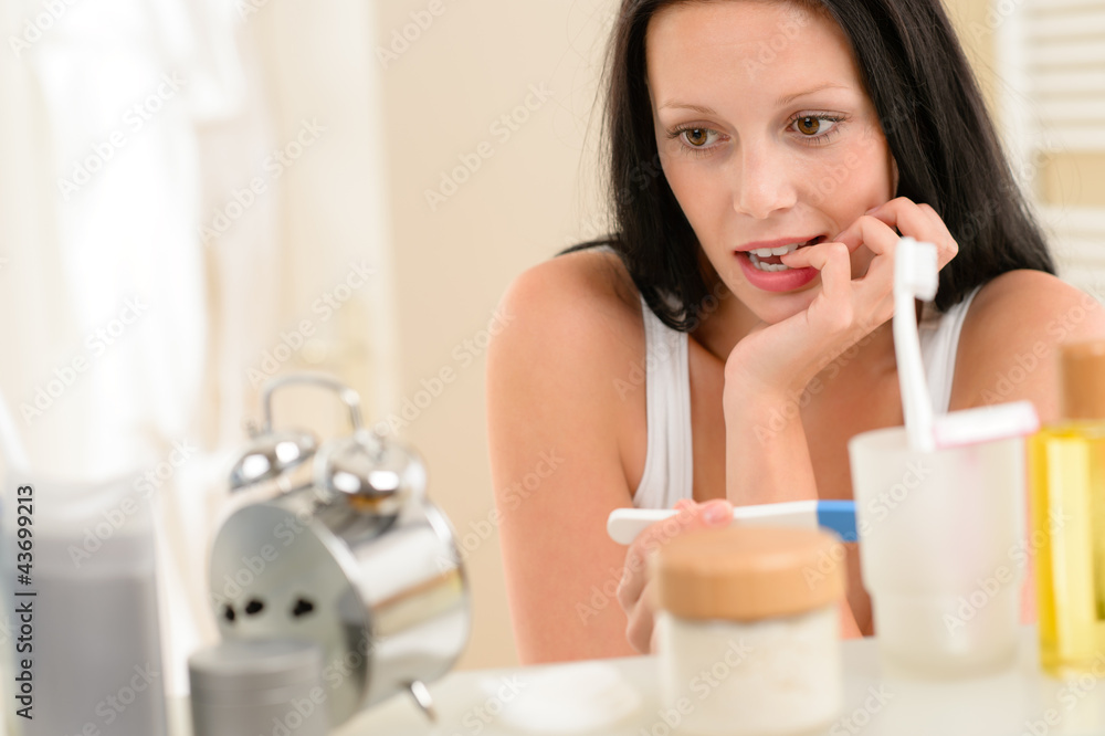 Woman expecting pregnancy test result in bathroom Woman expecting pregnancy test result in bathroom