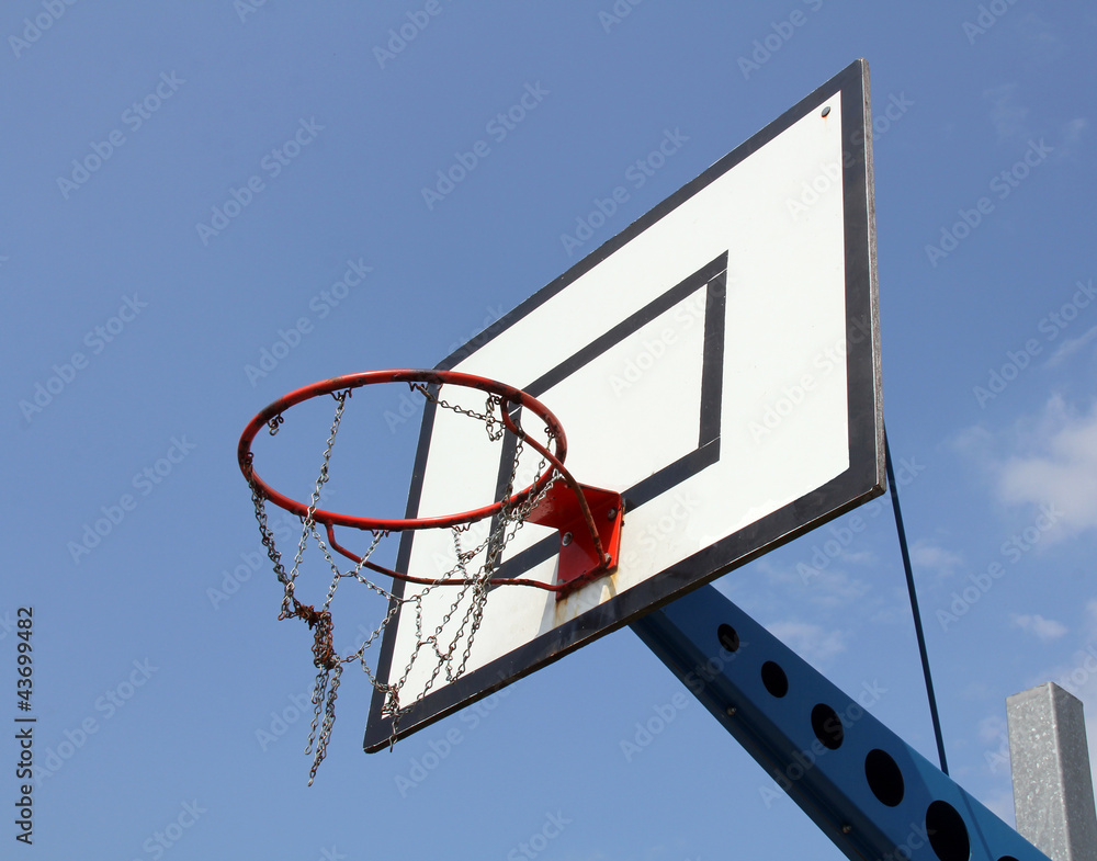 Basketball hoop against blue sky Basketball hoop against blue sky