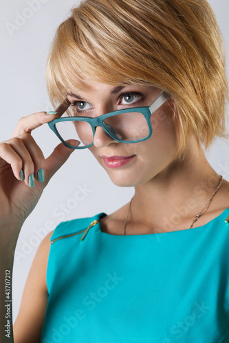 Fototapeta Naklejka Na Ścianę i Meble -  Beautiful business woman with glasses. Close-up portrait