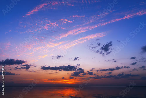 Fototapeta Naklejka Na Ścianę i Meble -  Beautiful seascape with orange warm sunrise