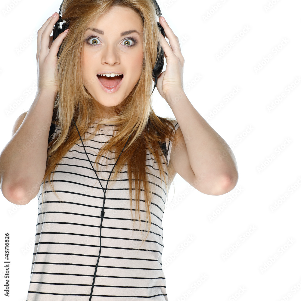 Beautiful girl with headphones isolated on a white background Beautiful girl with headphones isolated on a white background
