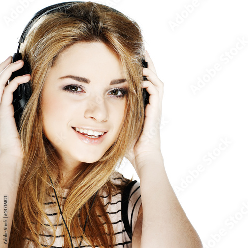 Beautiful girl with headphones isolated on a white background