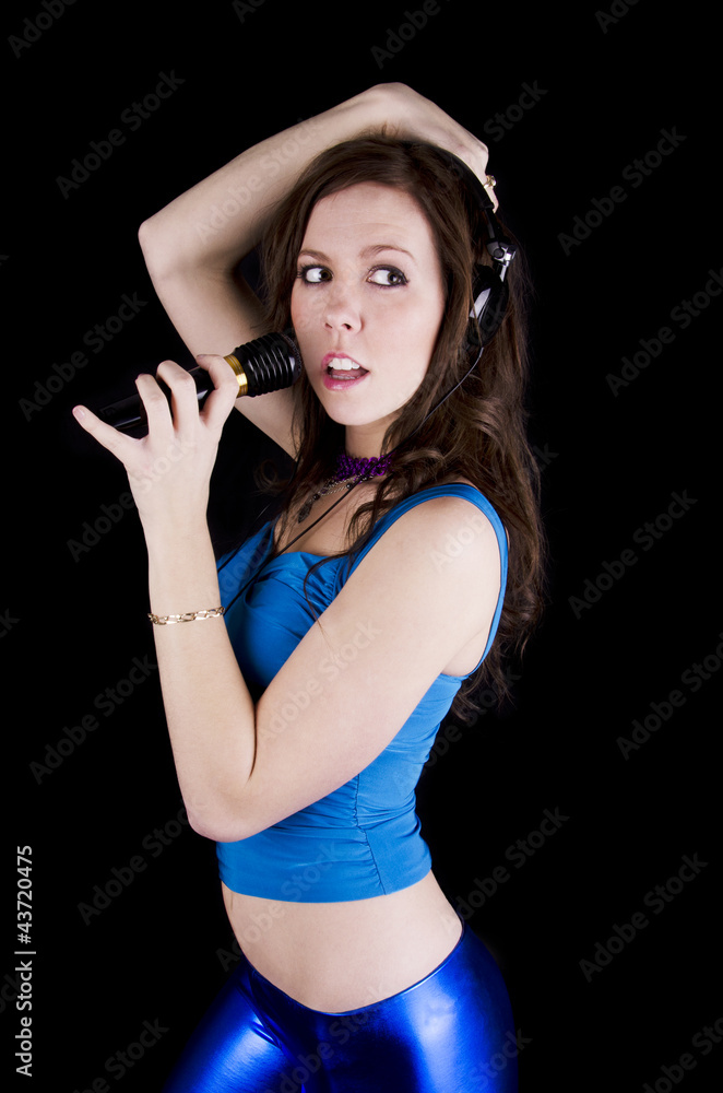 Fototapeta premium Young woman with microphone
