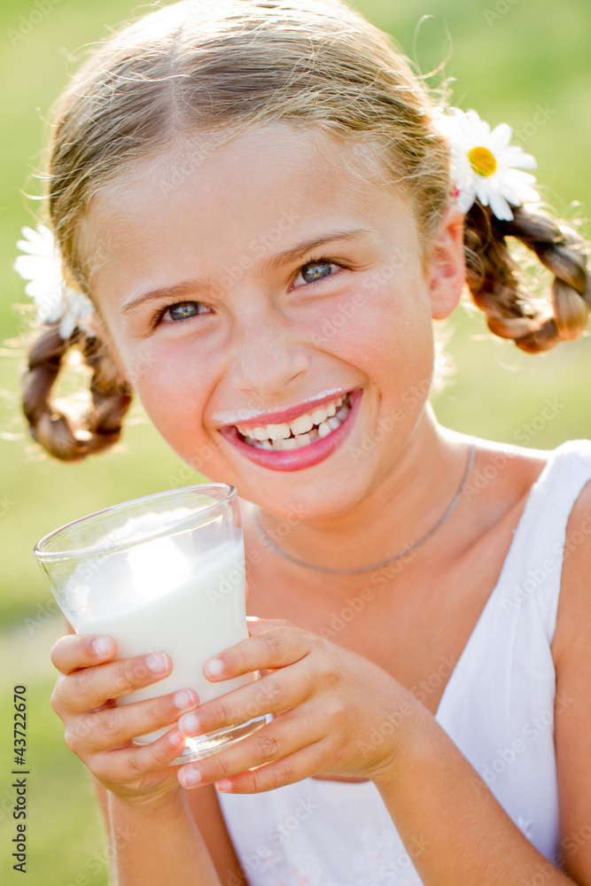 Portrait of lovely girl drinking fresh milk outdoors Portrait of lovely girl drinking fresh milk outdoors