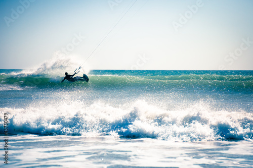 Kite surfing in waves. #43730479