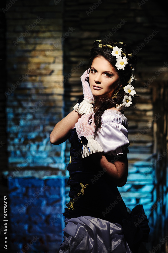 Fototapeta premium Girl with chamomile in the hair in vintage dress