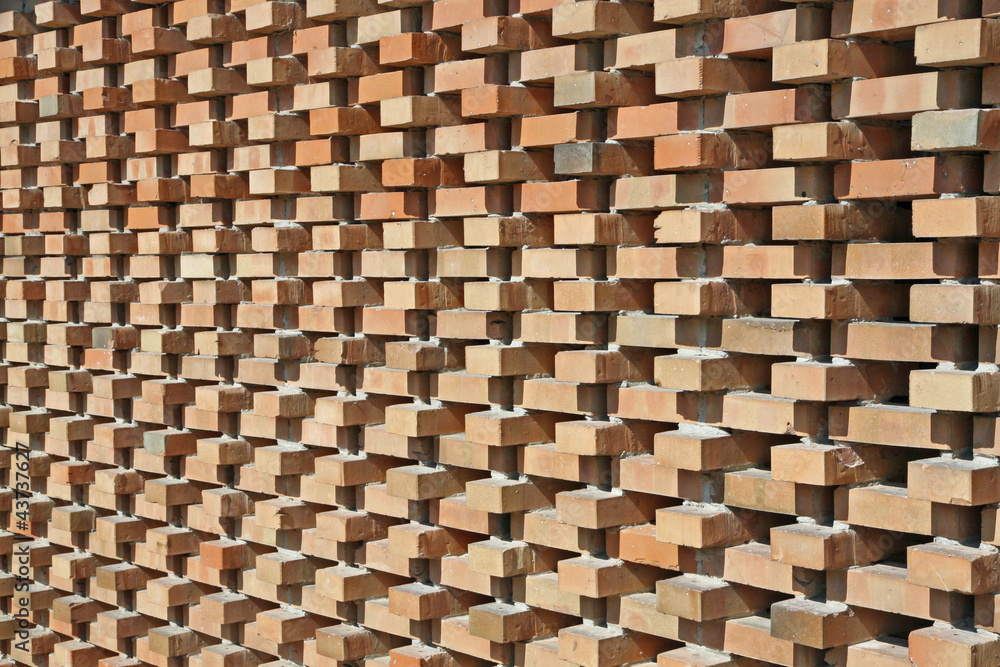 illuminated red wall bricks arranged orthogonally illuminated red wall bricks arranged orthogonally