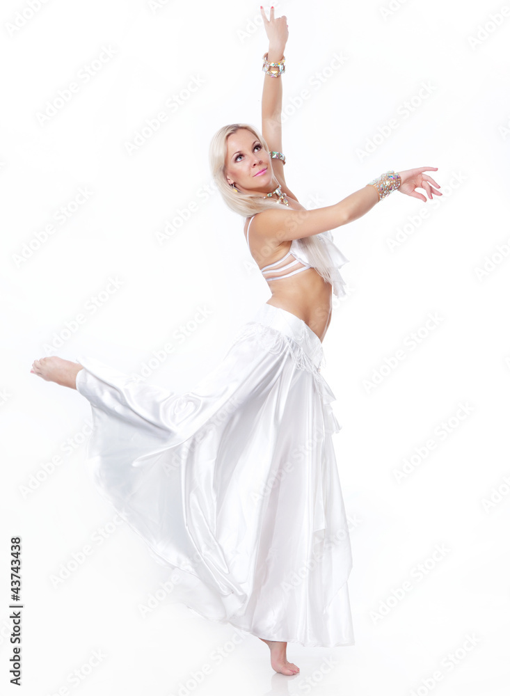 Belly dancer in a white dress. Belly dancer in a white dress.