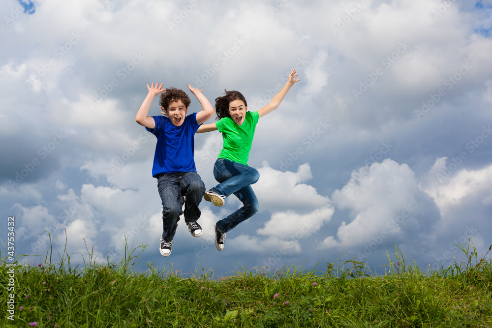 Girl and boy running, jumping outdoor Girl and boy running, jumping outdoor