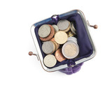 Gold, bronze and silver coins are in a violet purse