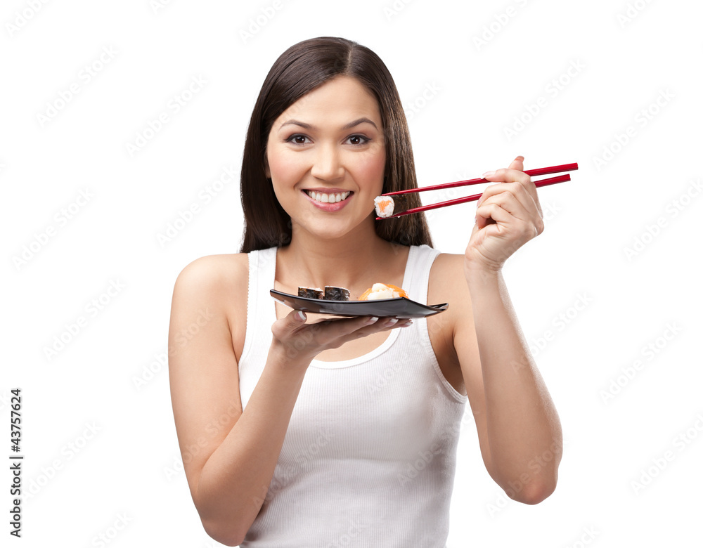 Beautiful girl holding sushi with a chopsticks, isolated Beautiful girl holding sushi with a chopsticks, isolated