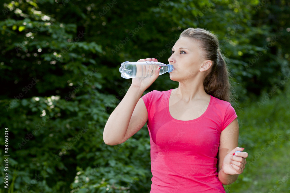 athletic girl with a bottle of water