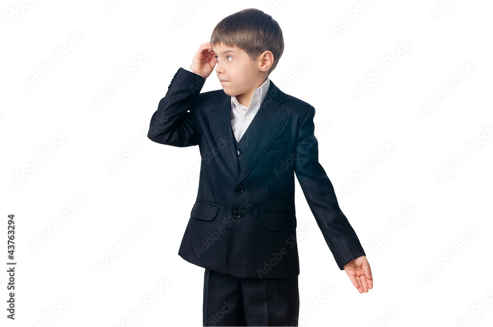 Confused boy scratching his head looking sideways Confused boy scratching his head looking sideways